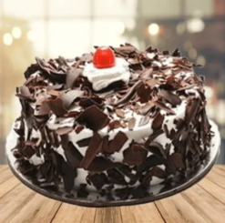cherry flake black forest cake with chocolate flakes and cherries