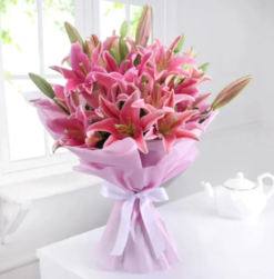 Fresh pink lily bouquet wrapped in tissue paper