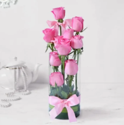 Fresh pink roses arranged in a glass vase bouquet