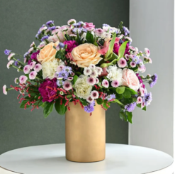 Golden vase flower arrangement for elegant gifting