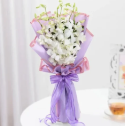 Fresh white orchid bouquet beautifully arranged for elegant flower gifting