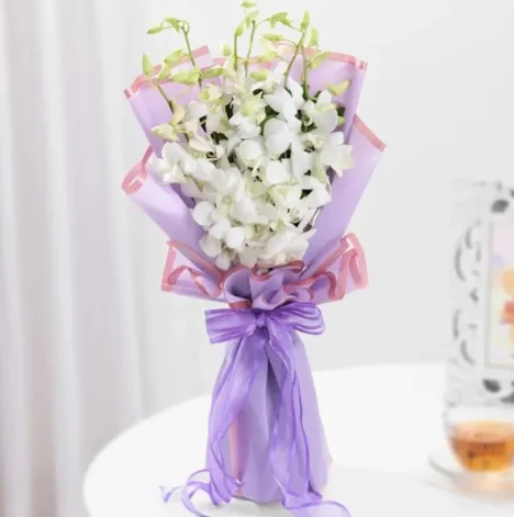 White Orchid Charm Bouquet Fresh white orchid bouquet beautifully arranged for elegant flower gifting