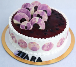 blueverra luxe cake with creamy layers and blueberry topping