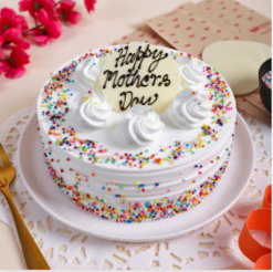 maa magic sprinkle cake with colorful toppings and creamy vanilla layers