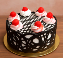 obsidian cherry forest cake with chocolate layers and cherry topping