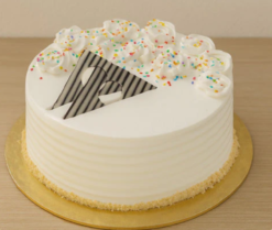veloura vanilla bliss cake with soft cream layers and smooth elegant finish